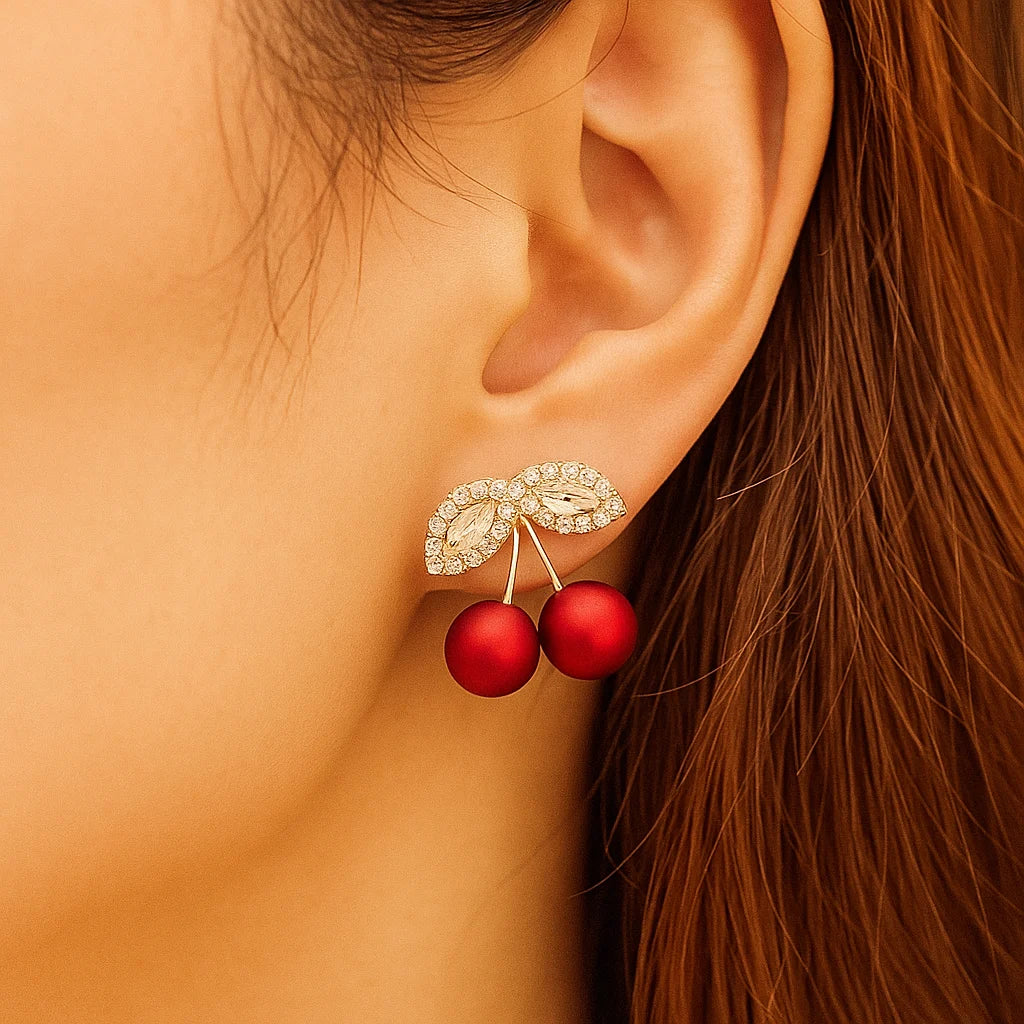 Red cherry stud earrings with rhinestone charm - model view