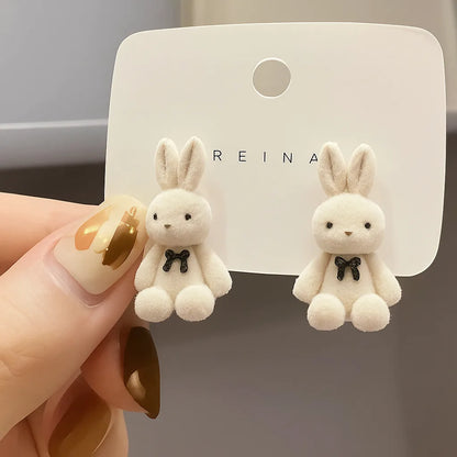 bunny stud earrings worn by woman cute design