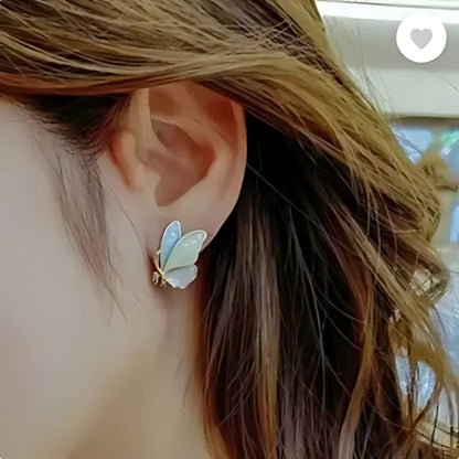 butterfly earrings worn by woman colorful stylish studs